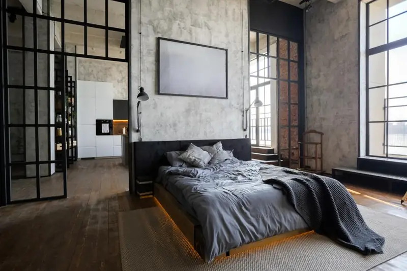 Bed made with grey Sleepgram bamboo sheets in a modern bedroom
